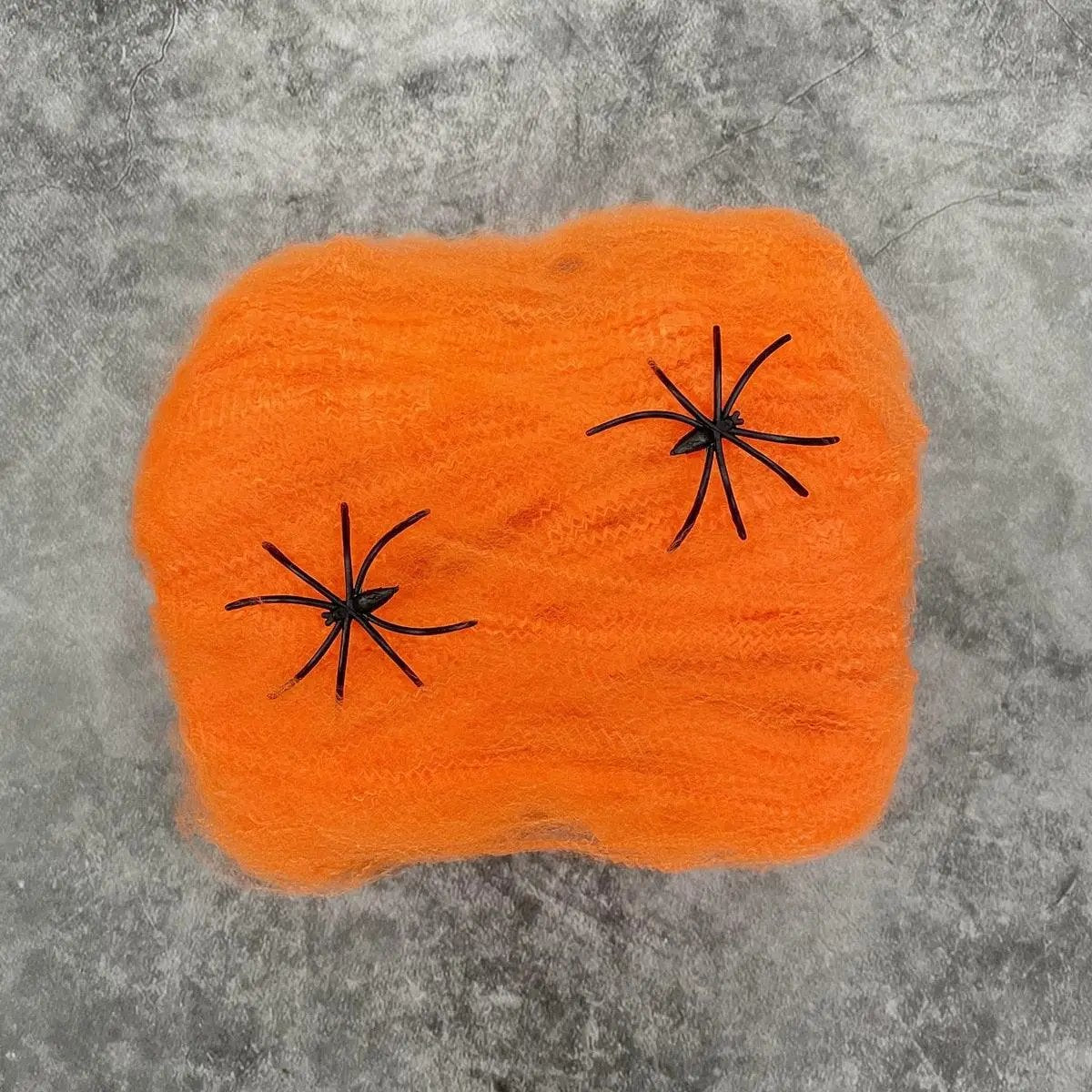 a close up of an orange piece of yarn