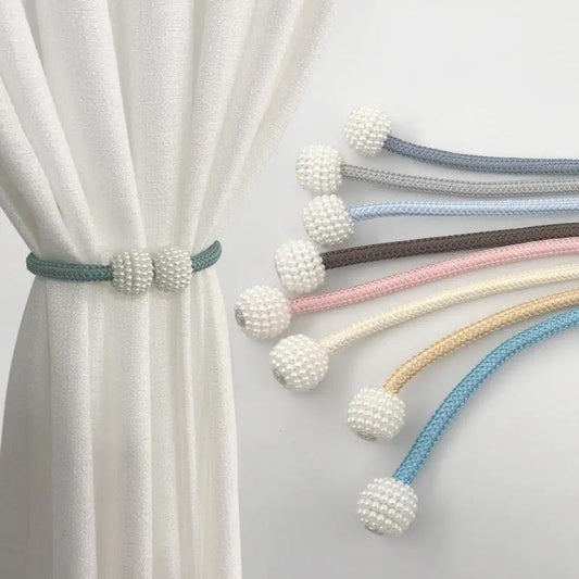 a set of four white beaded curtain ties