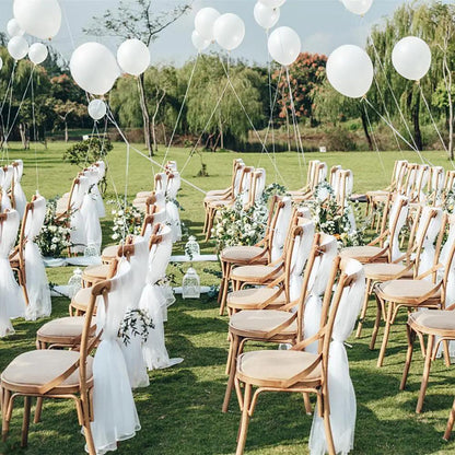 a bunch of chairs that are sitting in the grass