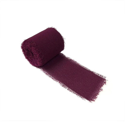 a roll of purple fabric on a white background