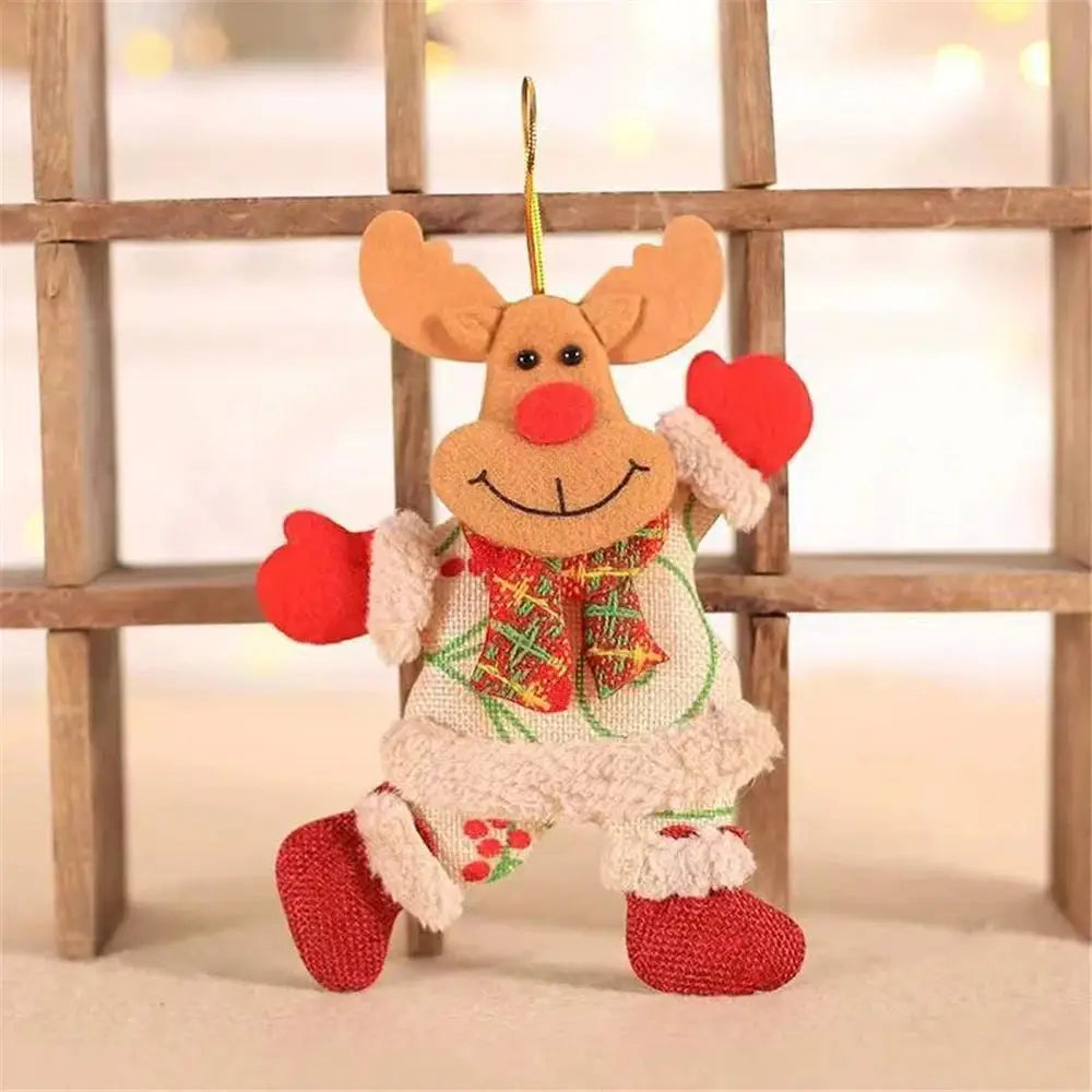 a knitted reindeer ornament hanging from a wooden fence