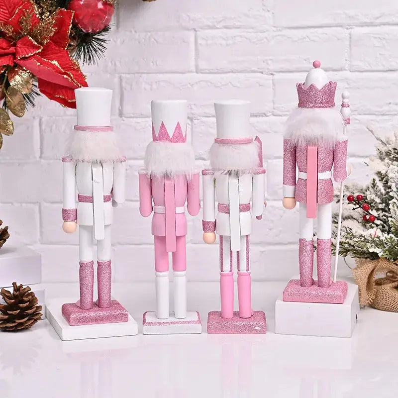 a group of nutcrackers on a table next to a christmas tree