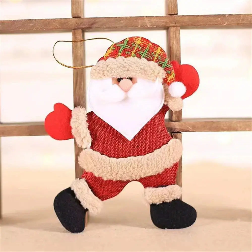 a stuffed santa clause hanging from a wooden ladder