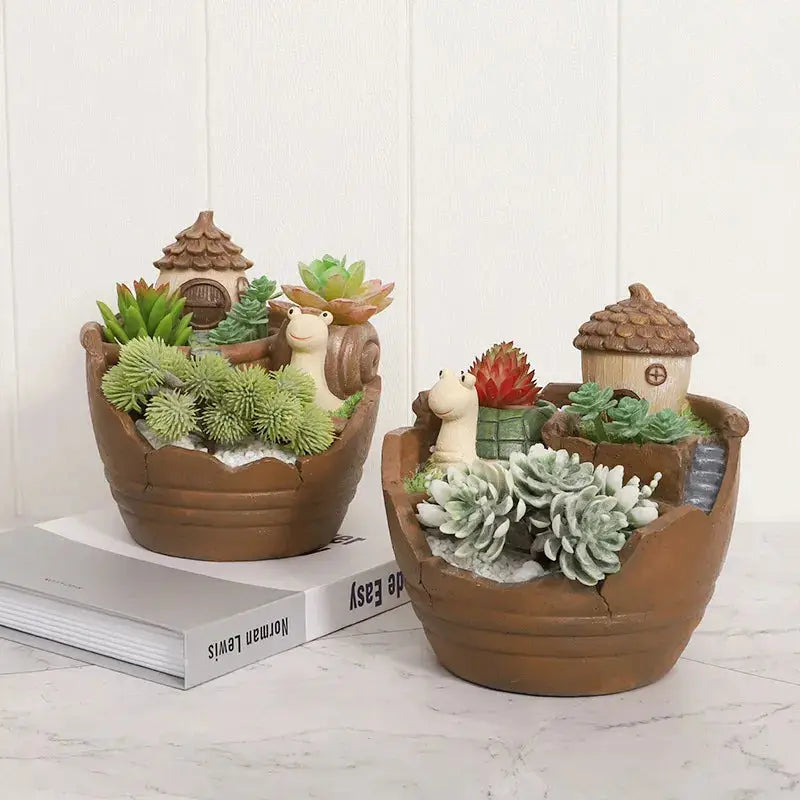 a couple of potted plants sitting on top of a table