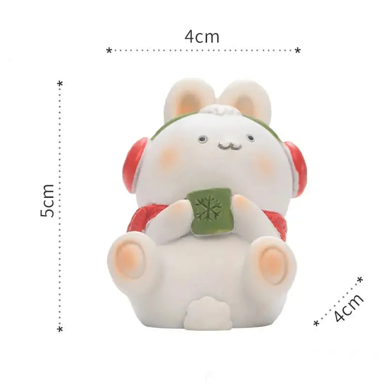 a small white bear figurine sitting on a white surface