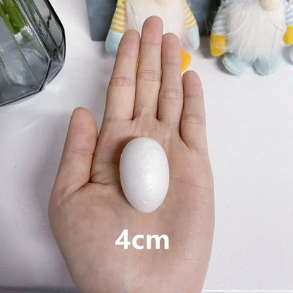 a hand holding a small white ball in it's palm