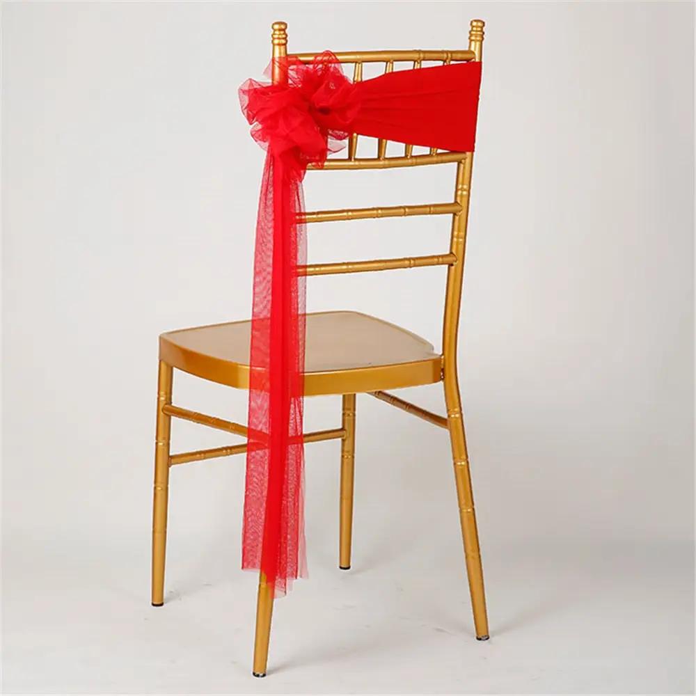 a chair with a red bow on the back of it