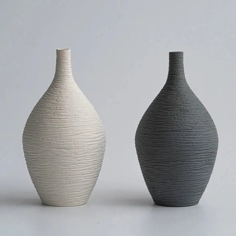 a couple of vases sitting next to each other