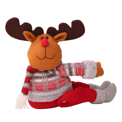 a stuffed animal with a red nose and antlers on it's head