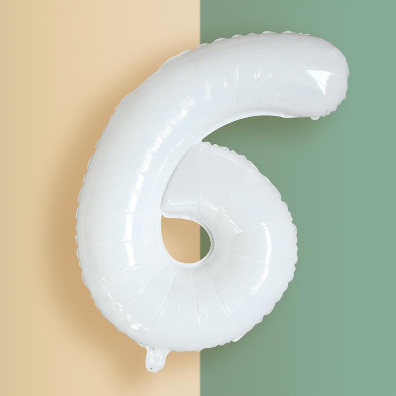 a white balloon shaped like a number six