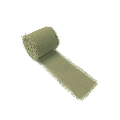 a roll of green fabric on a white background