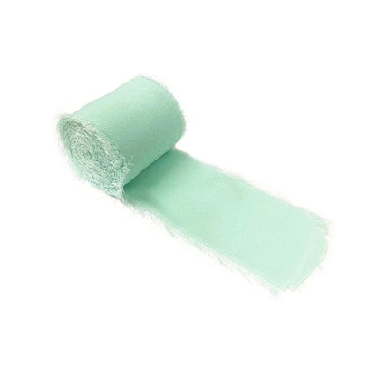 a roll of green tissue on a white background