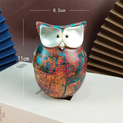 a colorful owl figurine sitting on top of a table