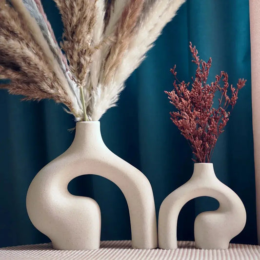 a couple of vases that are sitting on a table