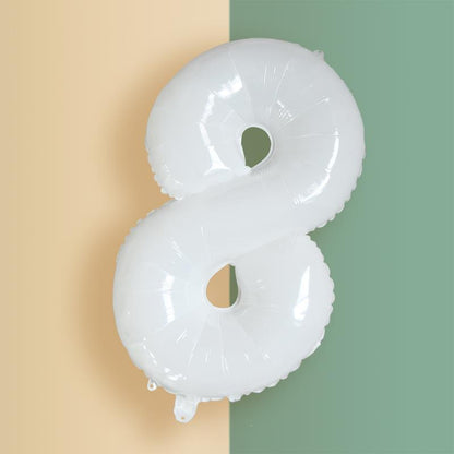 a balloon shaped like the letter s hanging on a wall