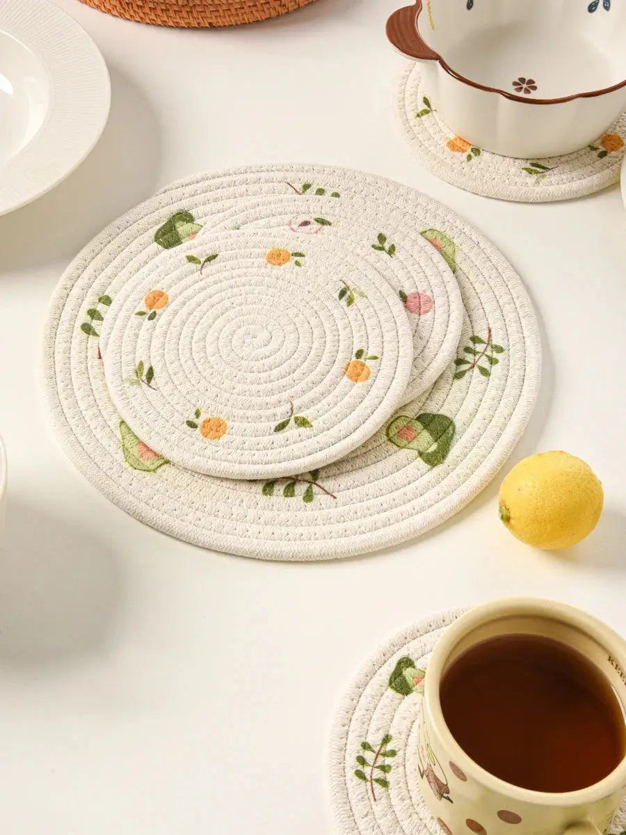 a white table topped with plates and cups filled with tea