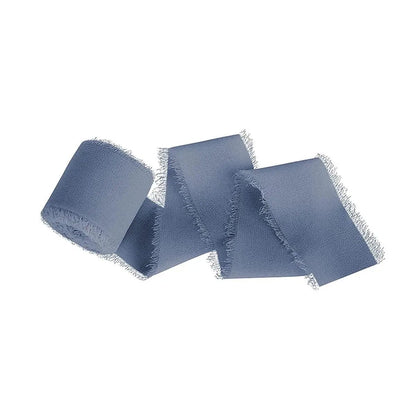 three pieces of blue cloth on a white background