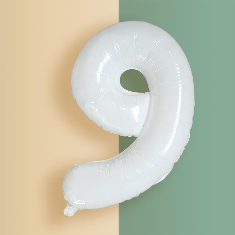 a white balloon shaped like the letter g