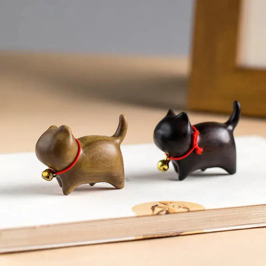 a couple of small black and brown dogs on a table