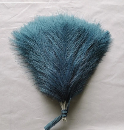 a piece of blue fur on a white background