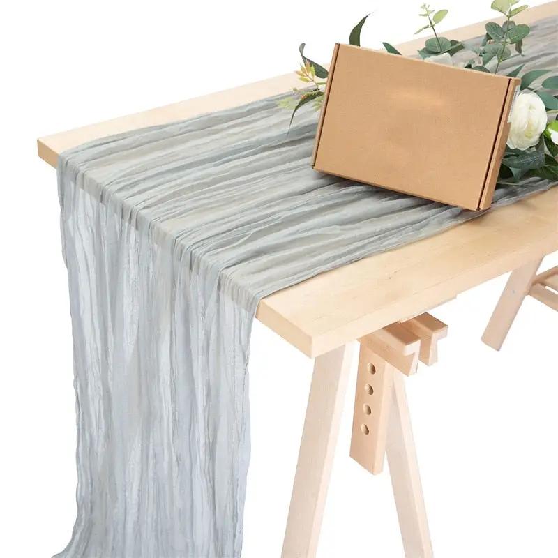 a table with a box and flowers on it