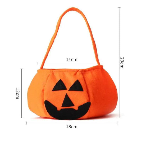 a small pumpkin purse with a face on it