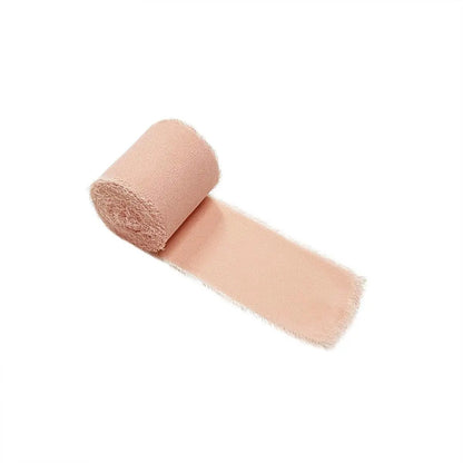 a roll of pink bandages on a white background