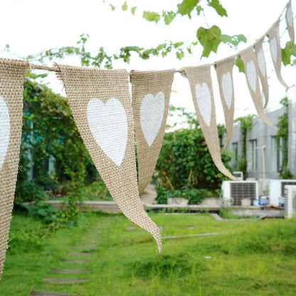 a couple of white hearts hanging from a line
