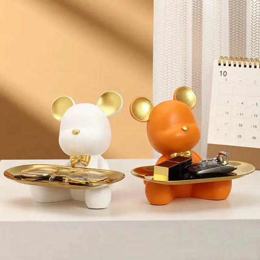 a desk with a desk calendar and a mouse figurine