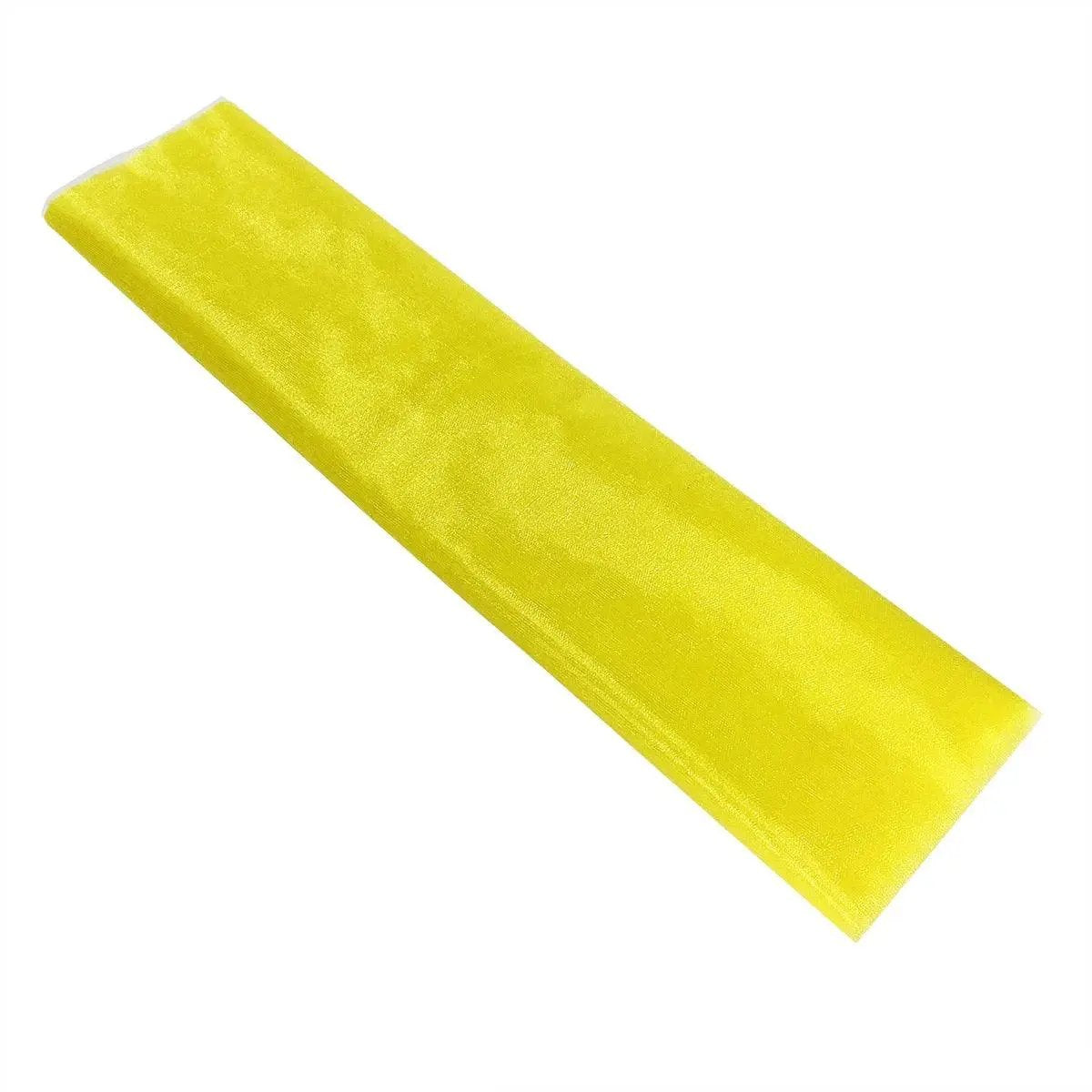 a piece of yellow tape on a white background