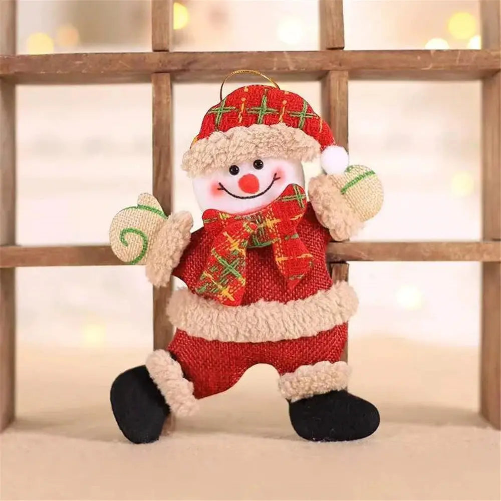a snowman ornament hanging from a wooden ladder
