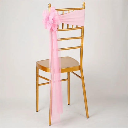a chair with a pink sash on it