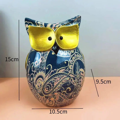 a blue vase with a yellow owl sitting on top of it