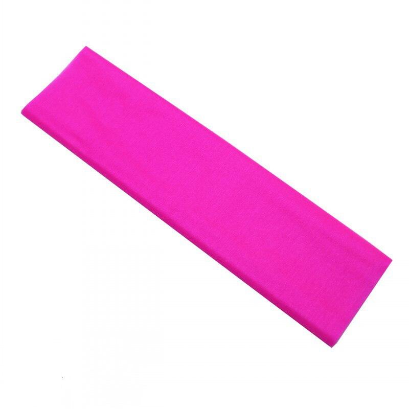 a bright pink headband on a white background