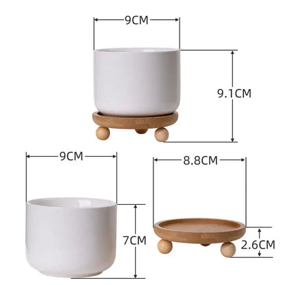 a white cup and a white cup on a wooden stand