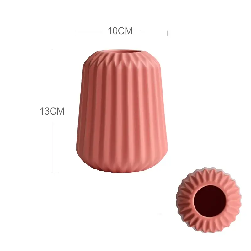 a large pink vase next to a smaller pink vase