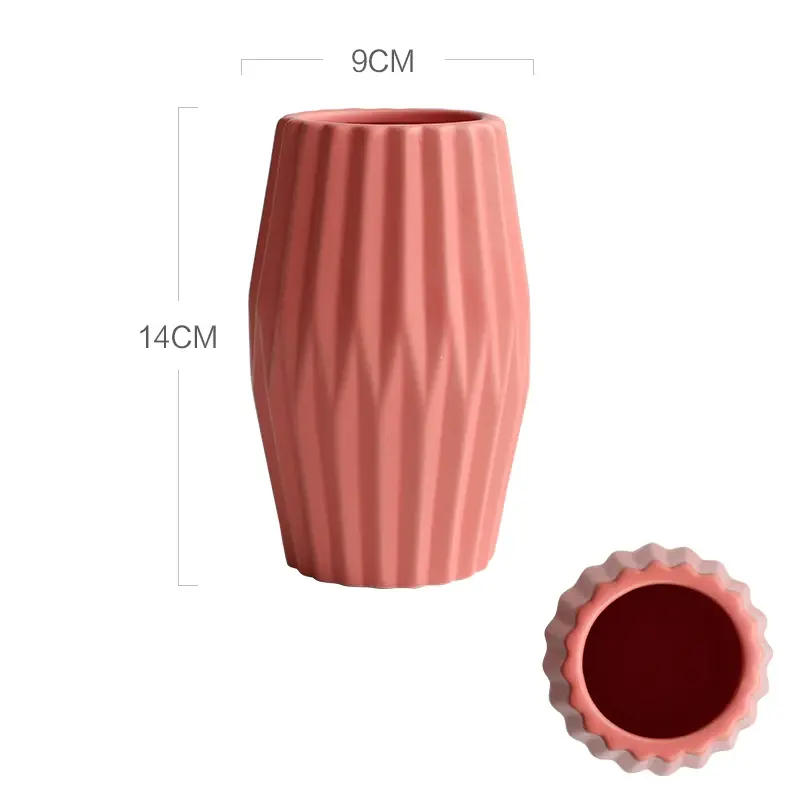 a large pink vase next to a smaller pink vase