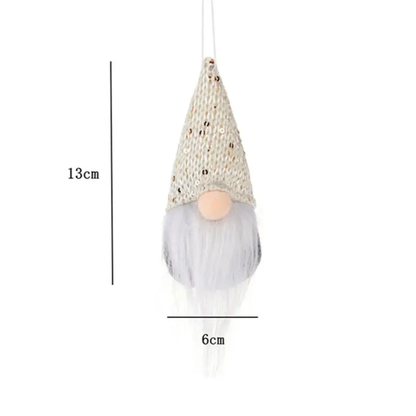 a white gnome ornament hanging from a string