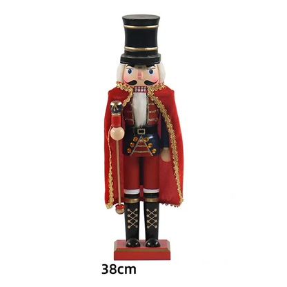 a wooden nutcracker with a red coat and hat
