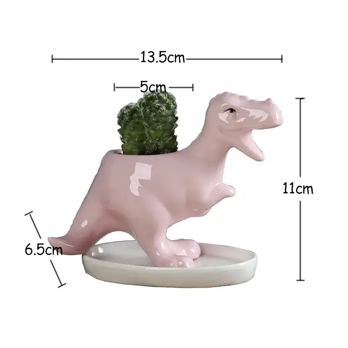 a pink dinosaur planter with a small broccoli in it's mouth