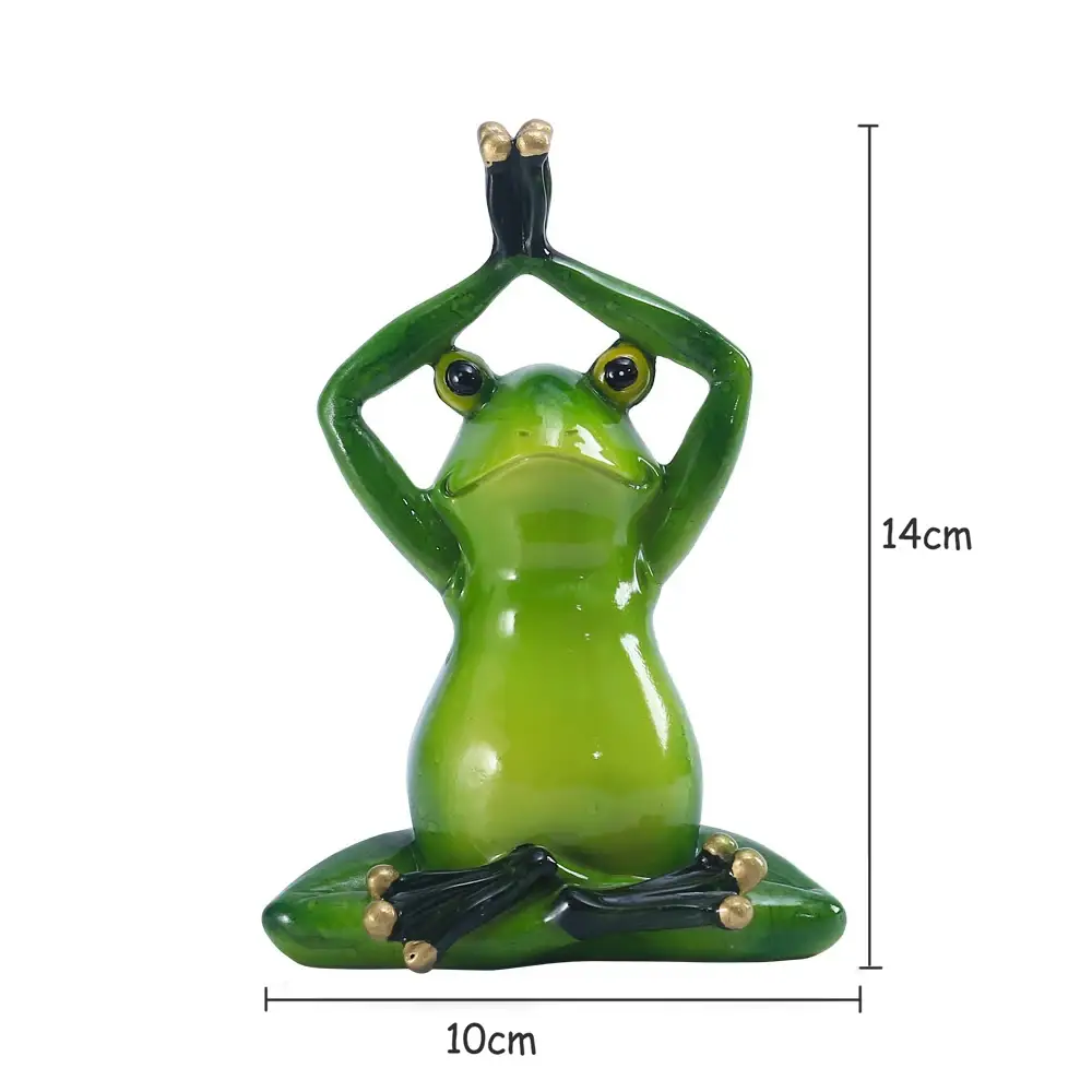 a green statue of a frog sitting in a yoga pose