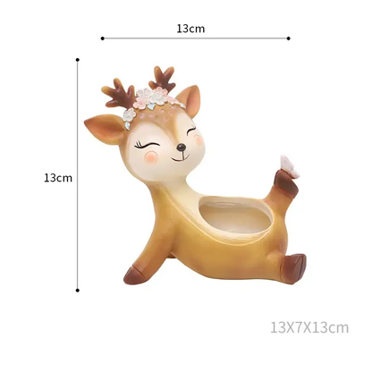 a toy deer with a flower crown on its head