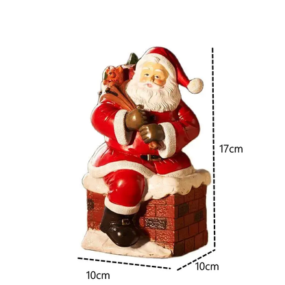 a santa clause figurine sitting on top of a brick wall