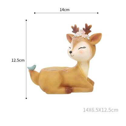 a toy deer with a flower in its hair