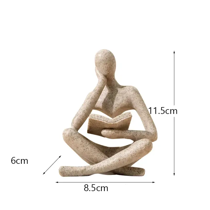 a statue of a person sitting in a yoga position