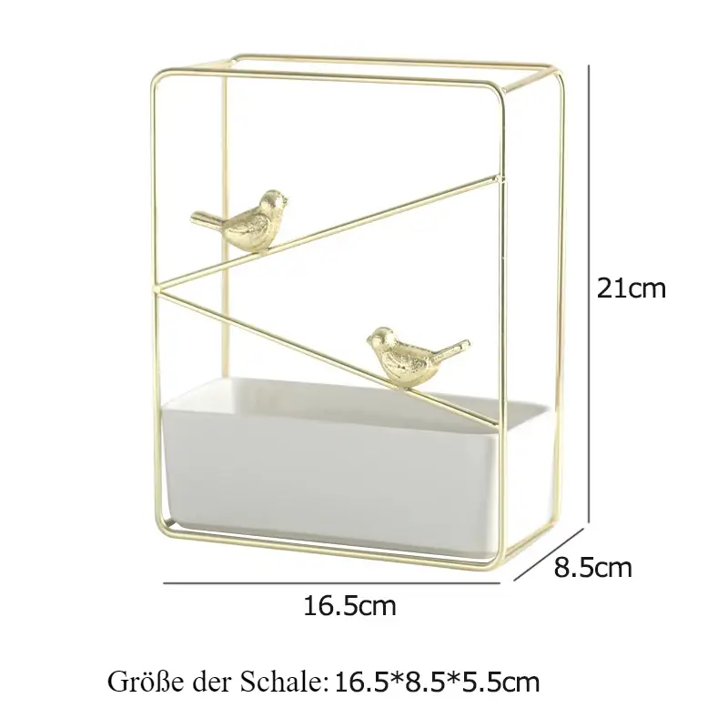 a gold metal shelf with two birds on it