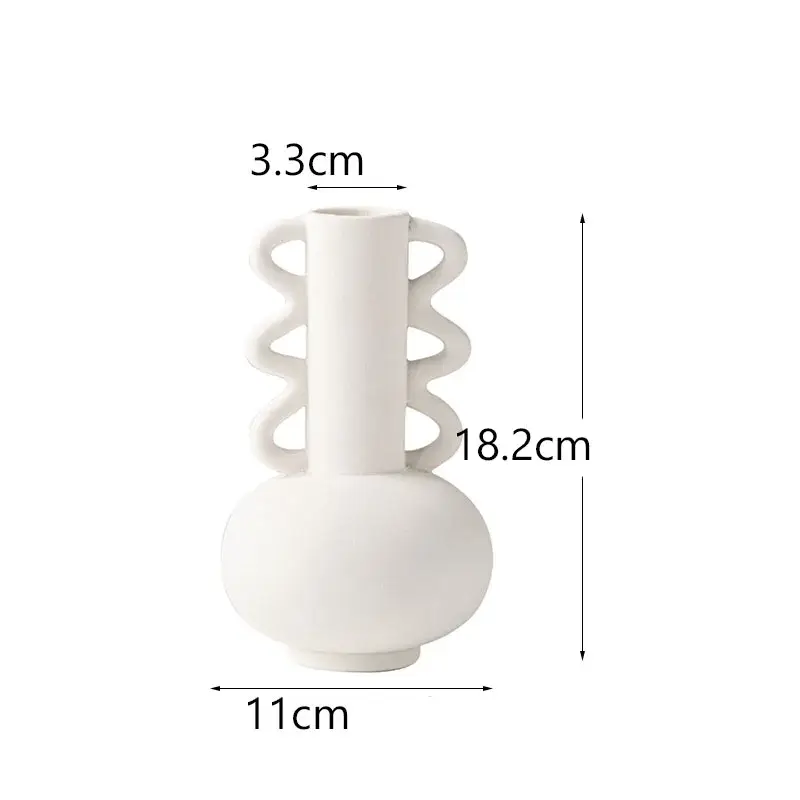 a white vase with a spiral design on it