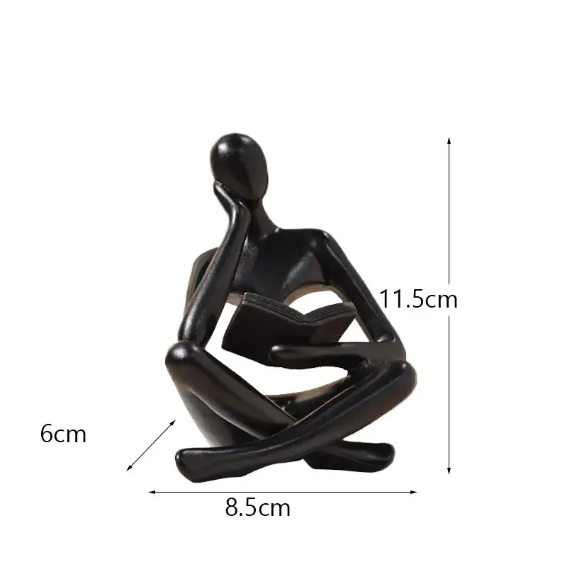 a statue of a person sitting in a yoga position