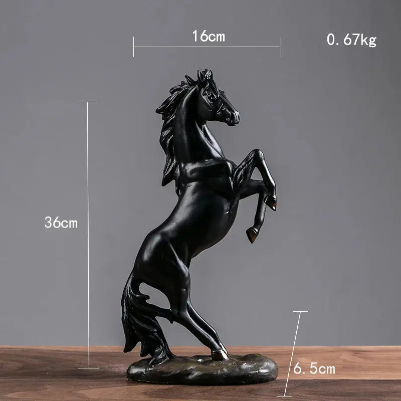 a black horse statue on a wooden table