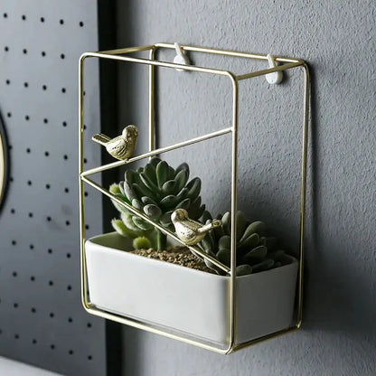 a white planter with a bird sitting on top of it